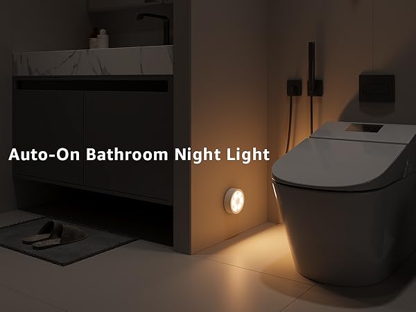 Bathroom led puck  light illuminating a corner of a bathroom 