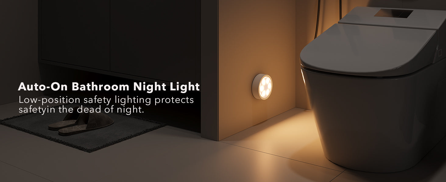 Bathroom rechargeable puck light illuminating a corner of a bathroom 