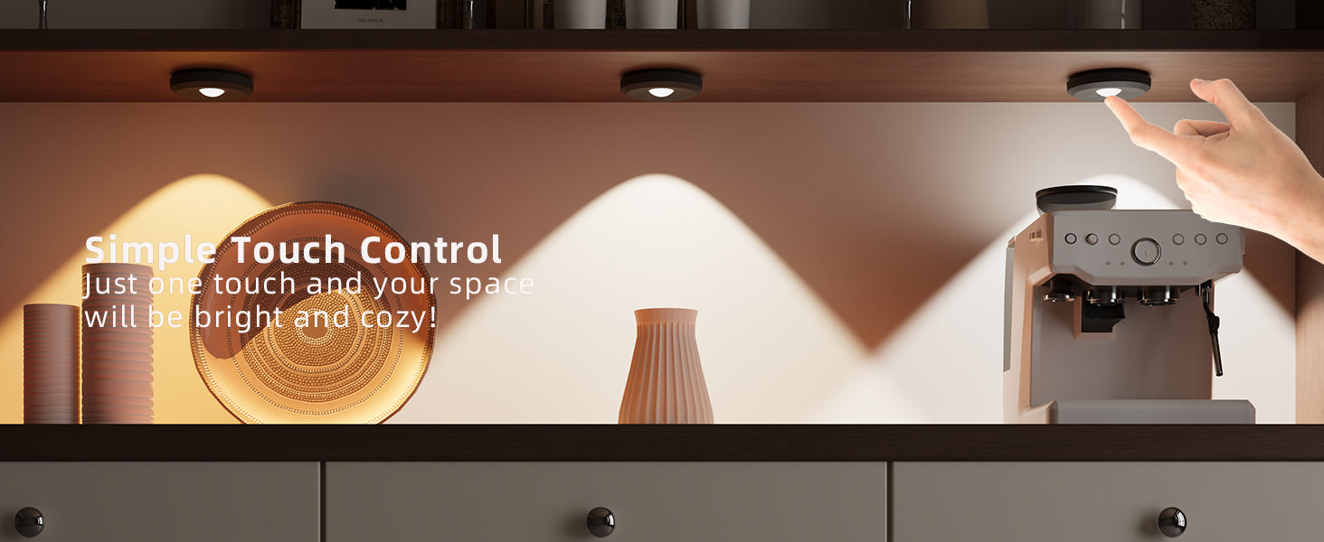 tap lights on a coffee machine with decorative vases and a warm light in the background.